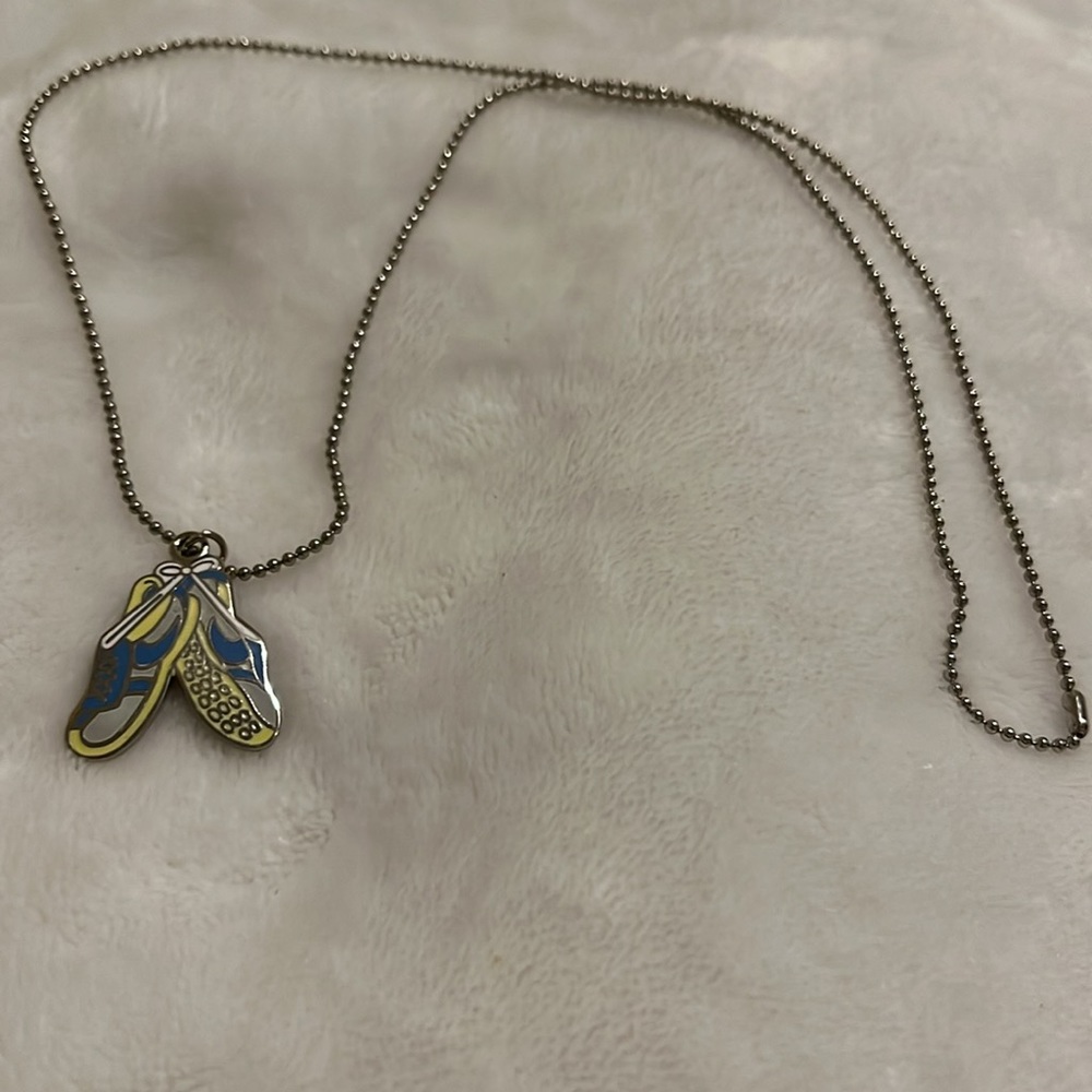 Necklace with sneakers pendant. Chain is thin silver tone balls. Up cycle